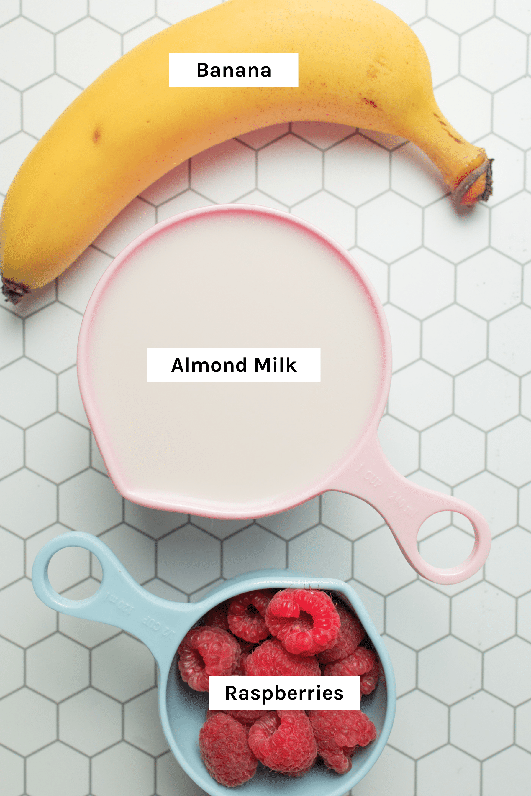 Recipe ingredients - banana, almond milk and raspberries/