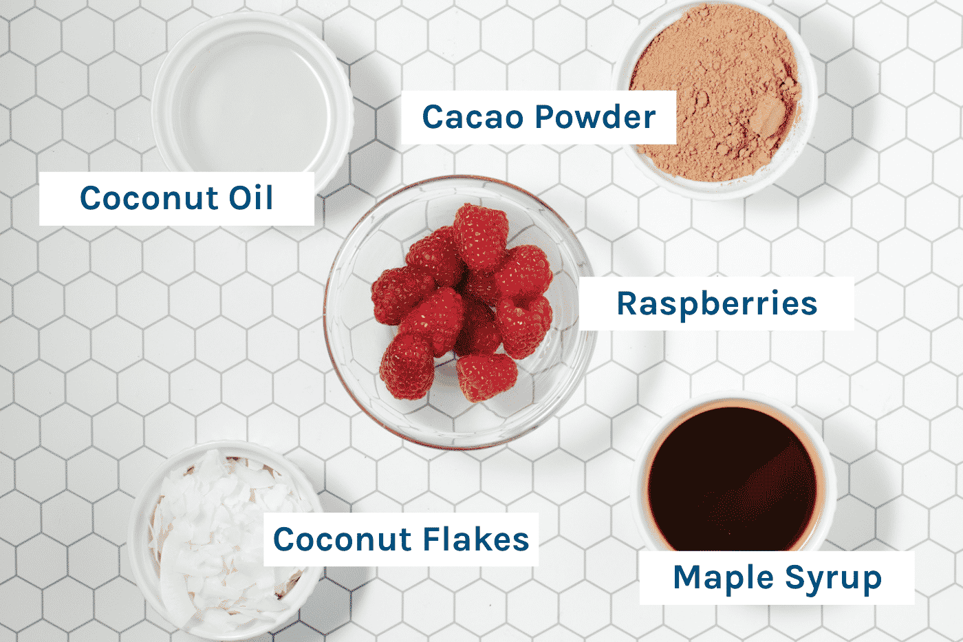 Ingredients - Raspberries, Cacao Powder, Coconut Oil, Maple Syrup and Coconut Flakes.