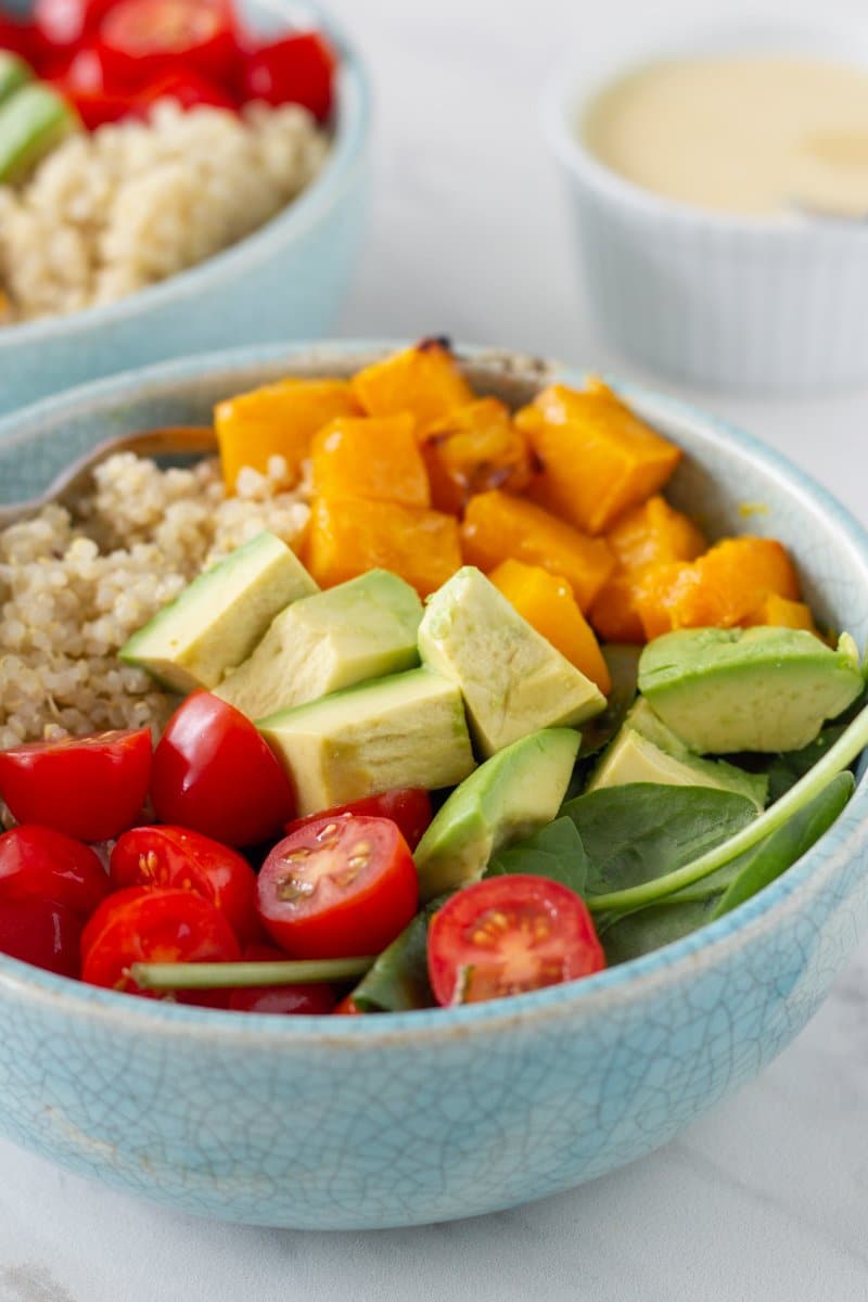 Blue bowl with quinoa salad.