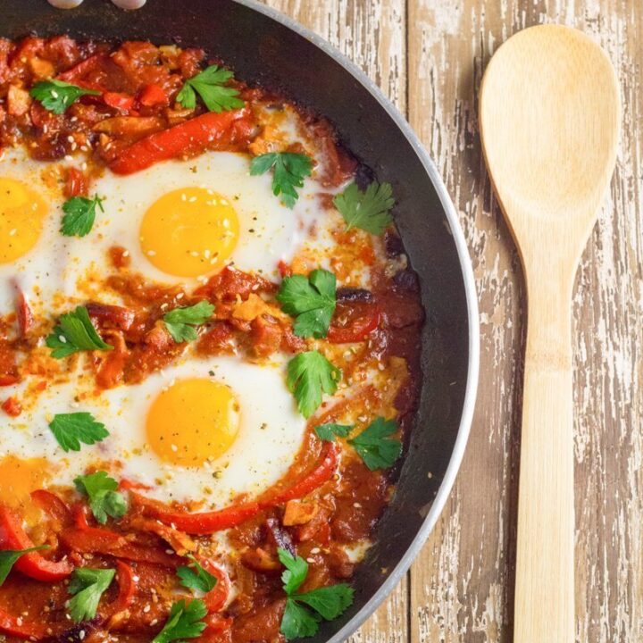 Shakshouka. Eggs poached in a tomato sauce with chilli peppers, onions and spices.
