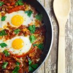 Shakshouka. Eggs poached in a tomato sauce with chilli peppers, onions and spices. YUMMY!