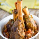 Slow Cooker Lamb Shanks. The meat will be literally falling off the bone once it has finished cooking. SO GOOD!