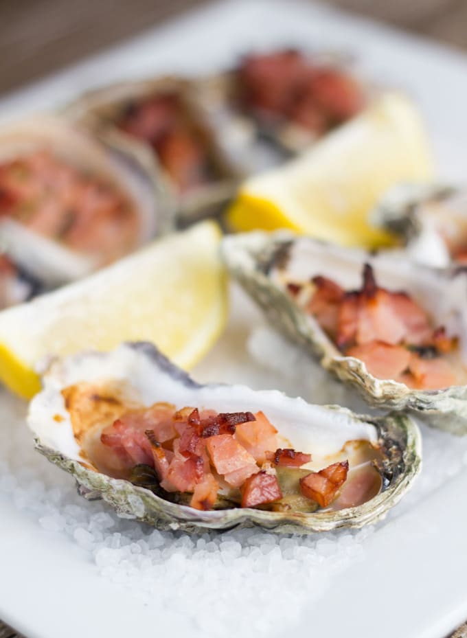 Oysters Kilpatrick topped with bacon and Worcestershire Sauce.