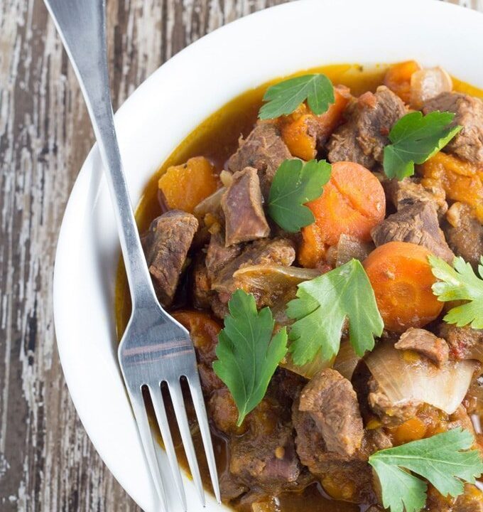 Slow Cooker Moroccan Lamb Stew. This meal is rich in flavour and so so tender, and very easy to make, meaning it's the perfect set-and-forget slow cooker meal.