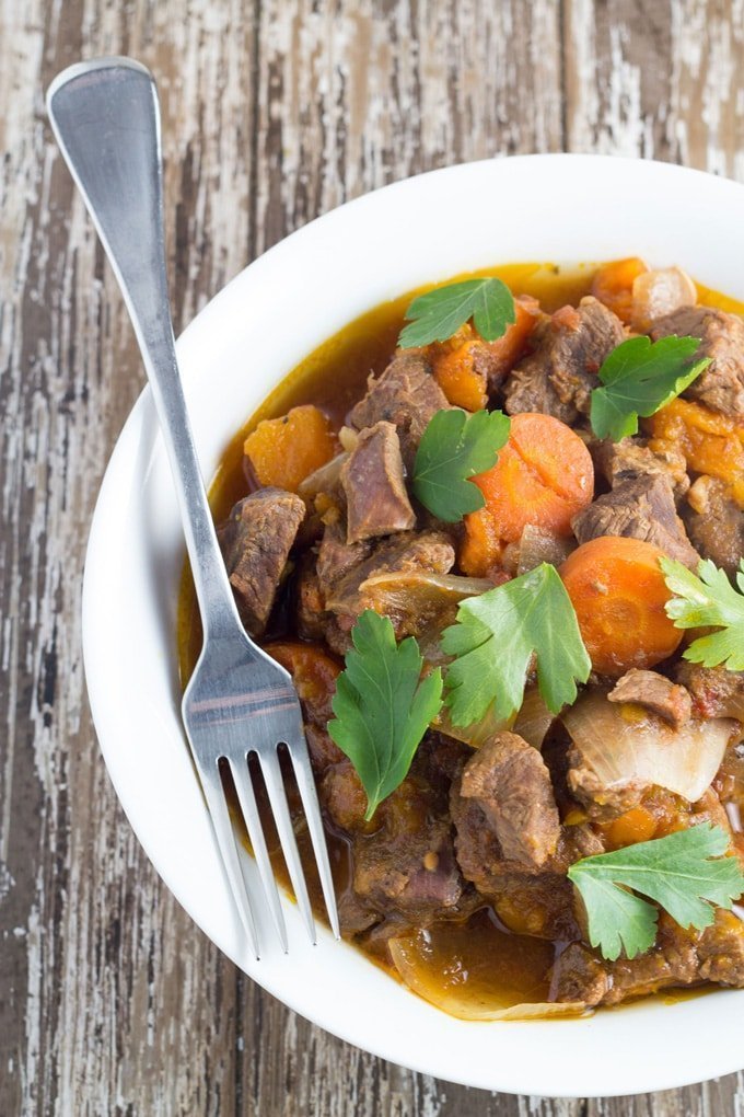 Slow Cooker Moroccan Lamb Stew. This meal is rich in flavour and so so tender, and very easy to make, meaning it's the perfect set-and-forget slow cooker meal.