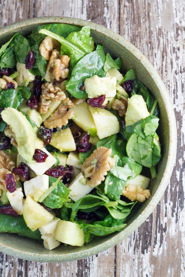 Avocado Walnut Cranberry Apple Salad in a green bowl