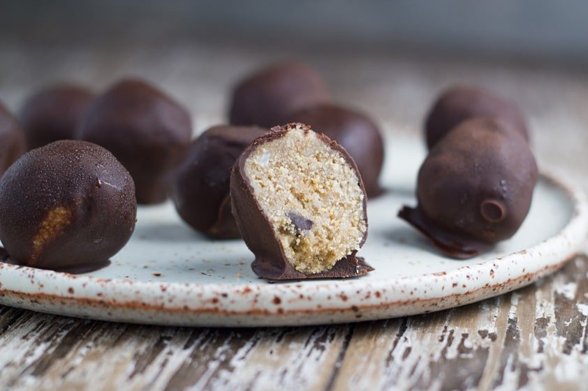 Cookie dough bliss balls on a plate.