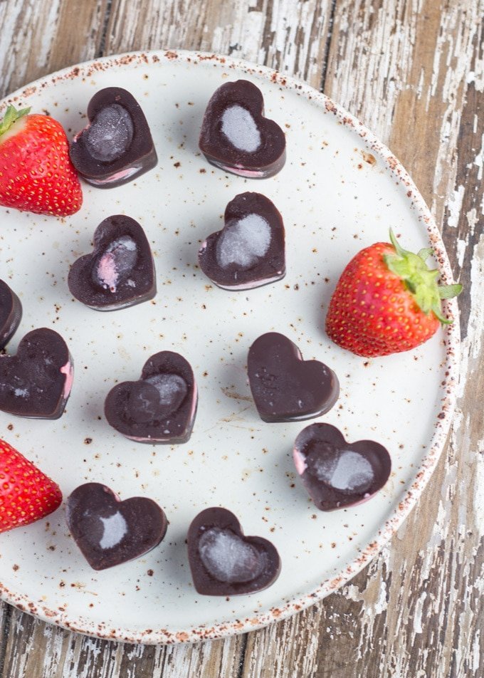 Strawberry heart chocolates on a plate/