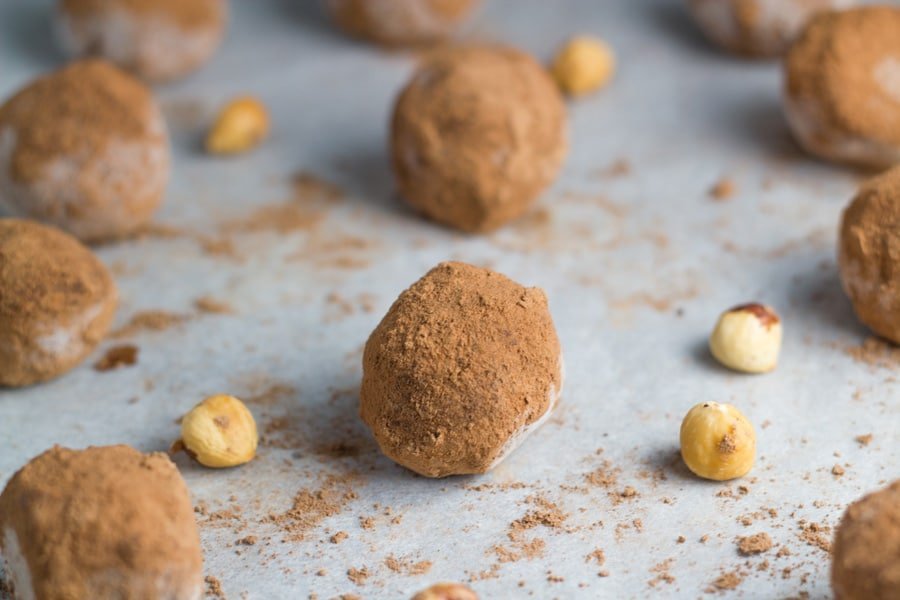 Truffles on a tray lined with baking paper.