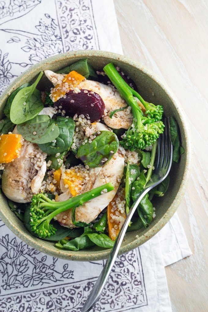 Chicken Quinoa salad in a bowl with broccoli, baby spinach, pumpkin and beetroot.