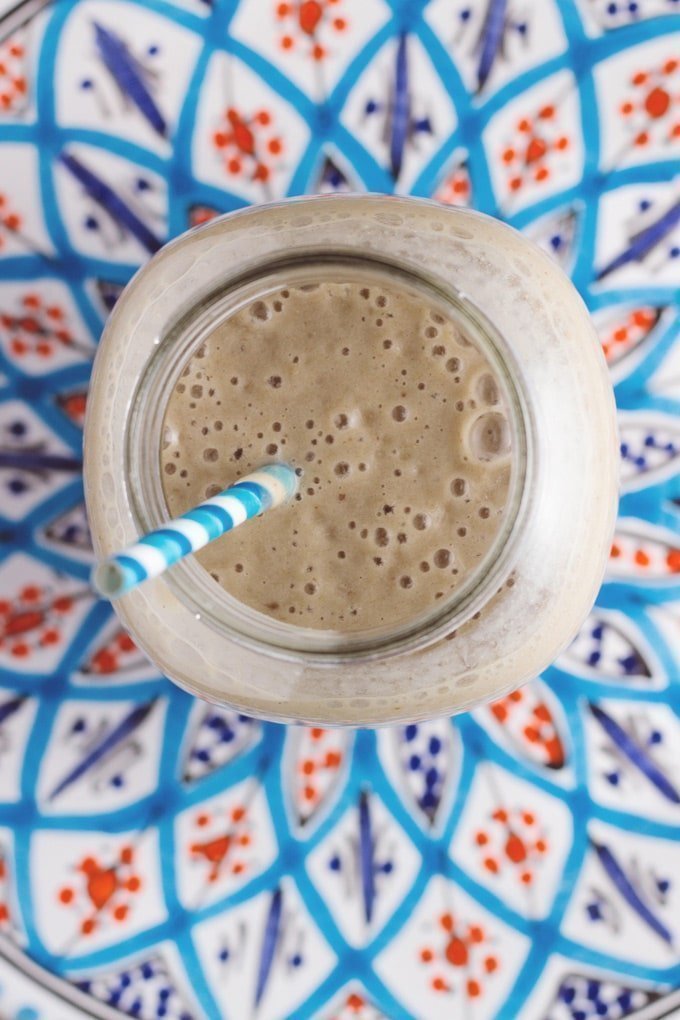 Salted Caramel smoothie with a blue and white straw