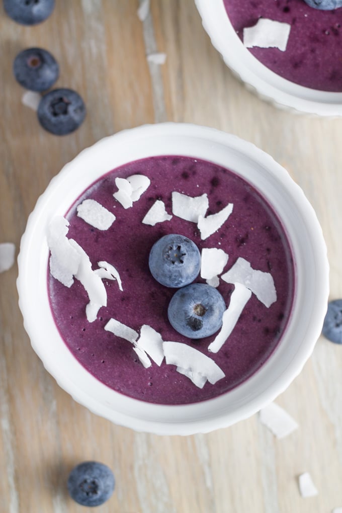 Mousse topped with blueberries and coconut.