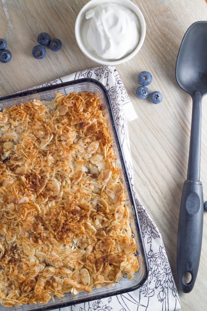 Gluten Free Blueberry Crisp with Coconut Whipped Cream just out of the  oven.