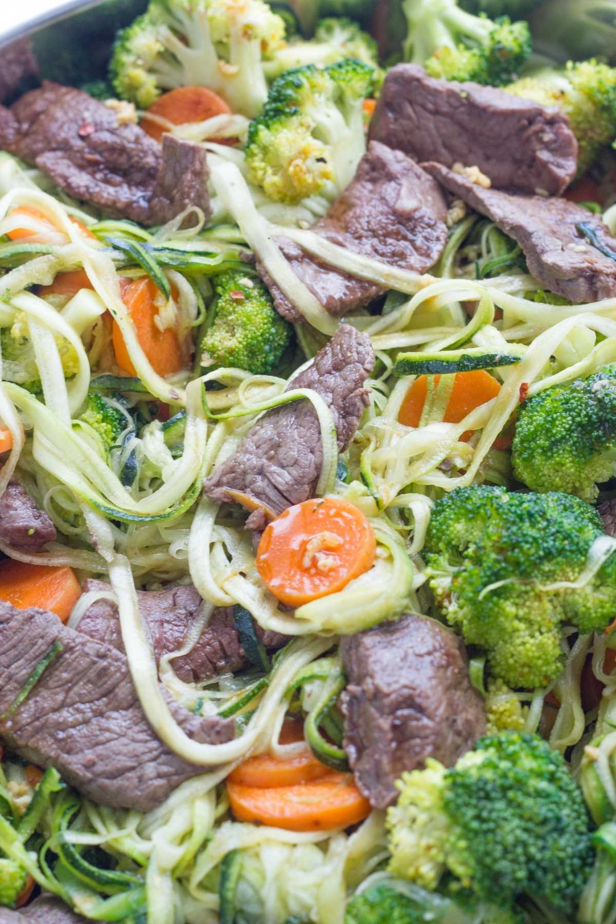 Zoodle ingredients - beef, zucchini noodles, broccoli, carrot.