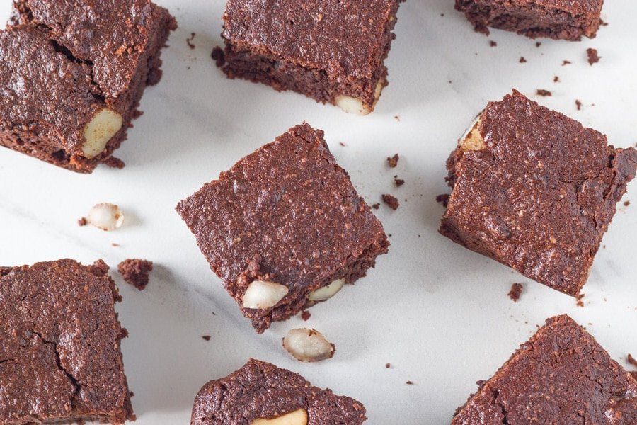 Brownies on a white kitchen bench.