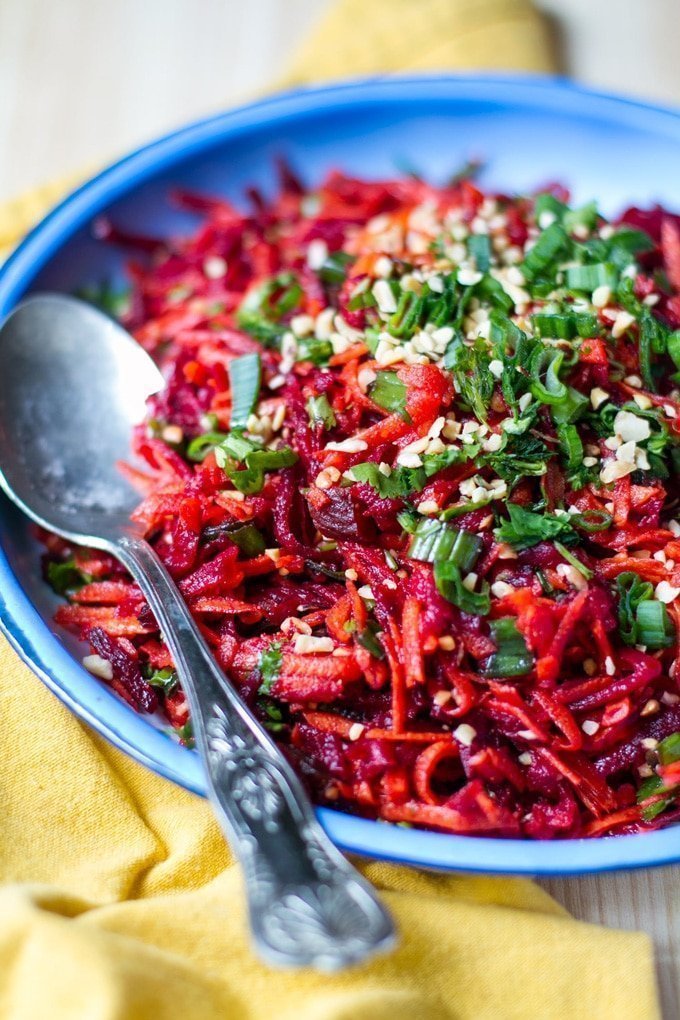 A bowl of beetroot and carrot salad with moroccan dressing. 