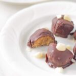 Raw Chocolate Caramel Macadamia Truffles. Make the perfect after dinner treat! They are delicious and look amazing! Your guests won't believe that you actually made them.