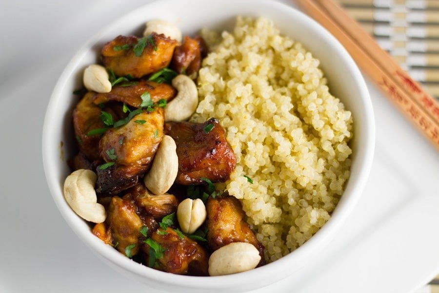 Bowl of crock pot cashew chicken with quinoa.