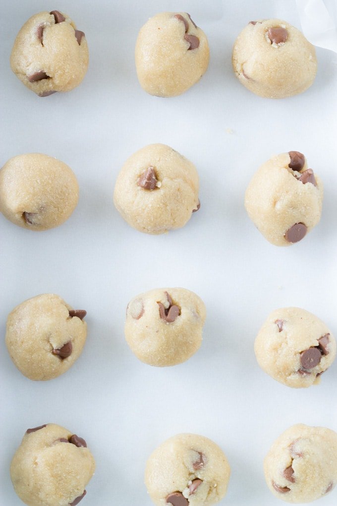 cookie dough formed into balls ready to be place into the oven