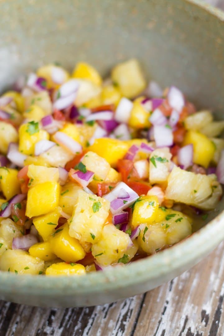 This mango pineapple salsa is sure to be a hit at your next bbq. It also works amazingly with mexican food or chicken, fish or pork dishes. 