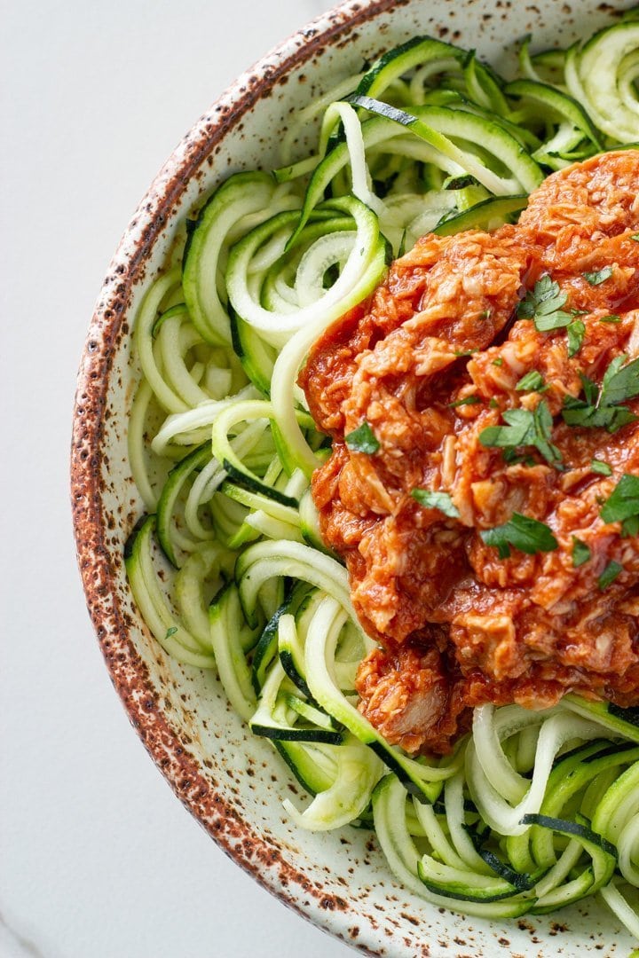 top down view of zucchini pasta with tuna pasta sauce in a bowl