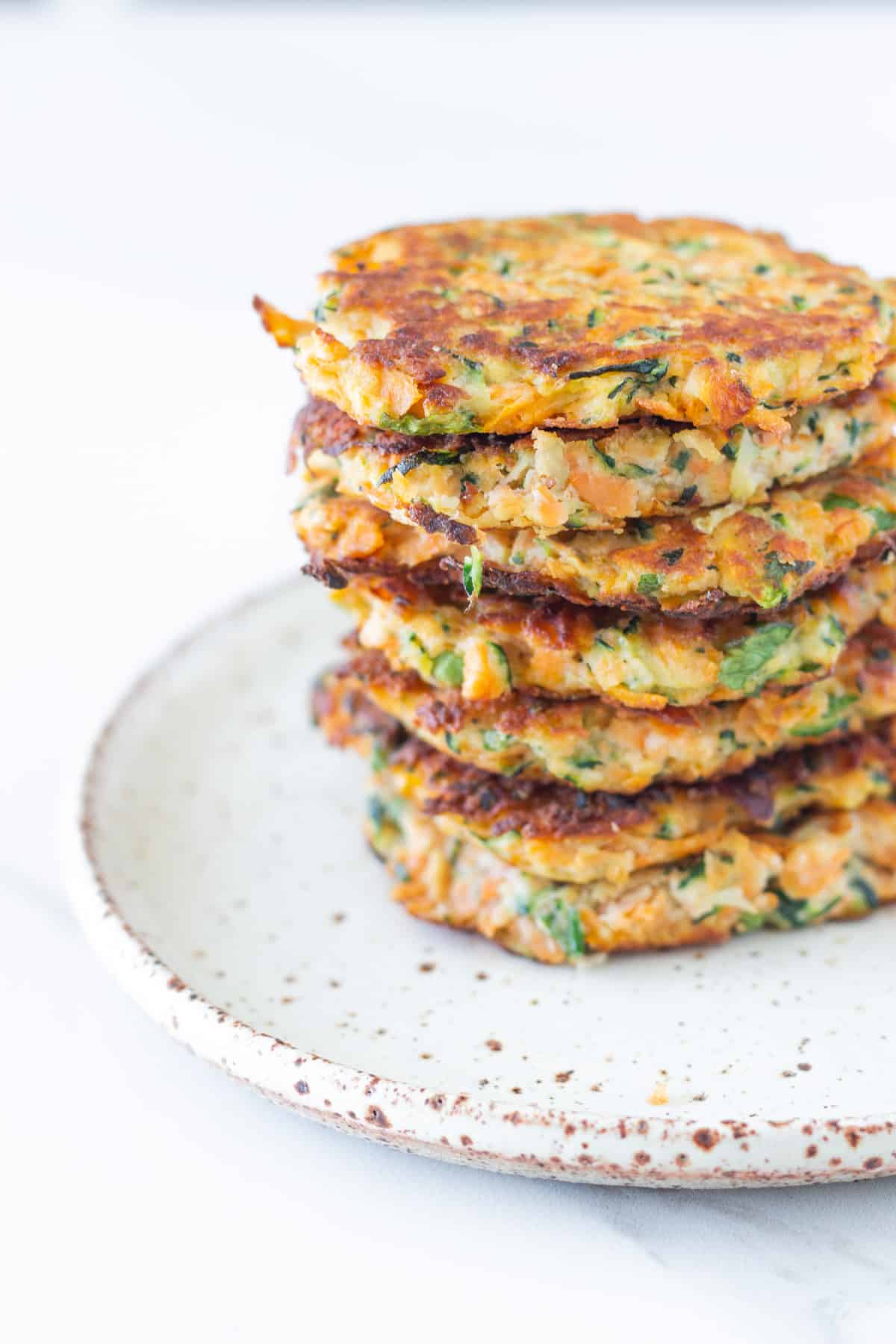 Stack of fritters on a plate.