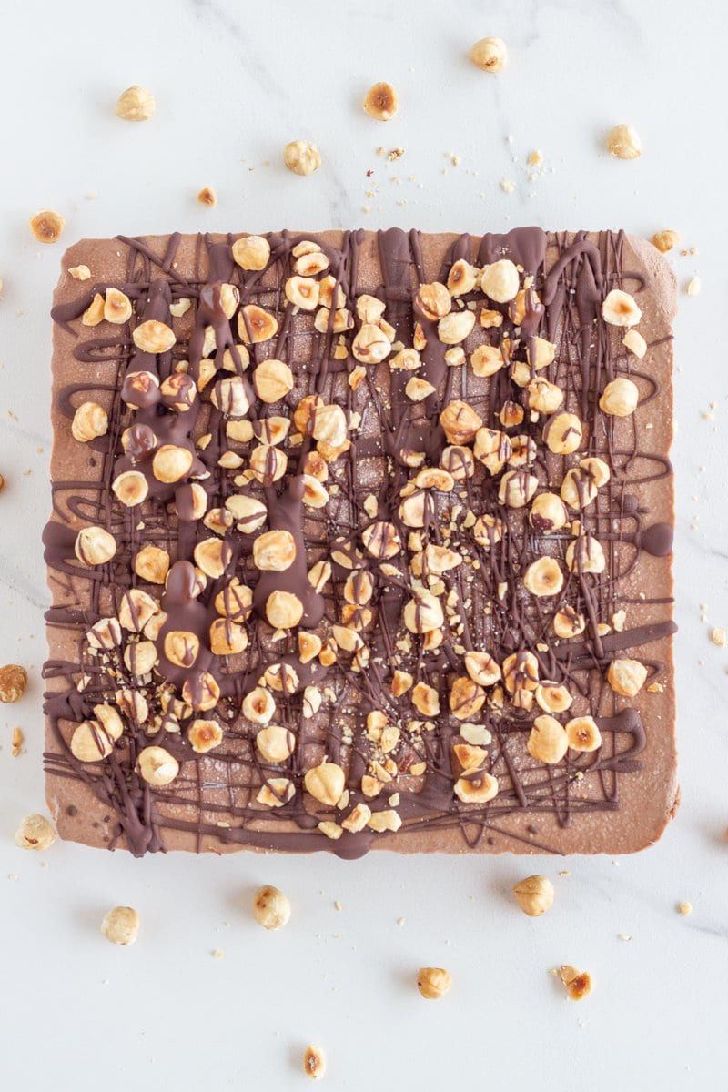 Raw Nutella slice. This delicious no-bake bar is made with my version of the super popular choc nutty spread but with way less sweetener (non-refined too) plus it is super easy to make.