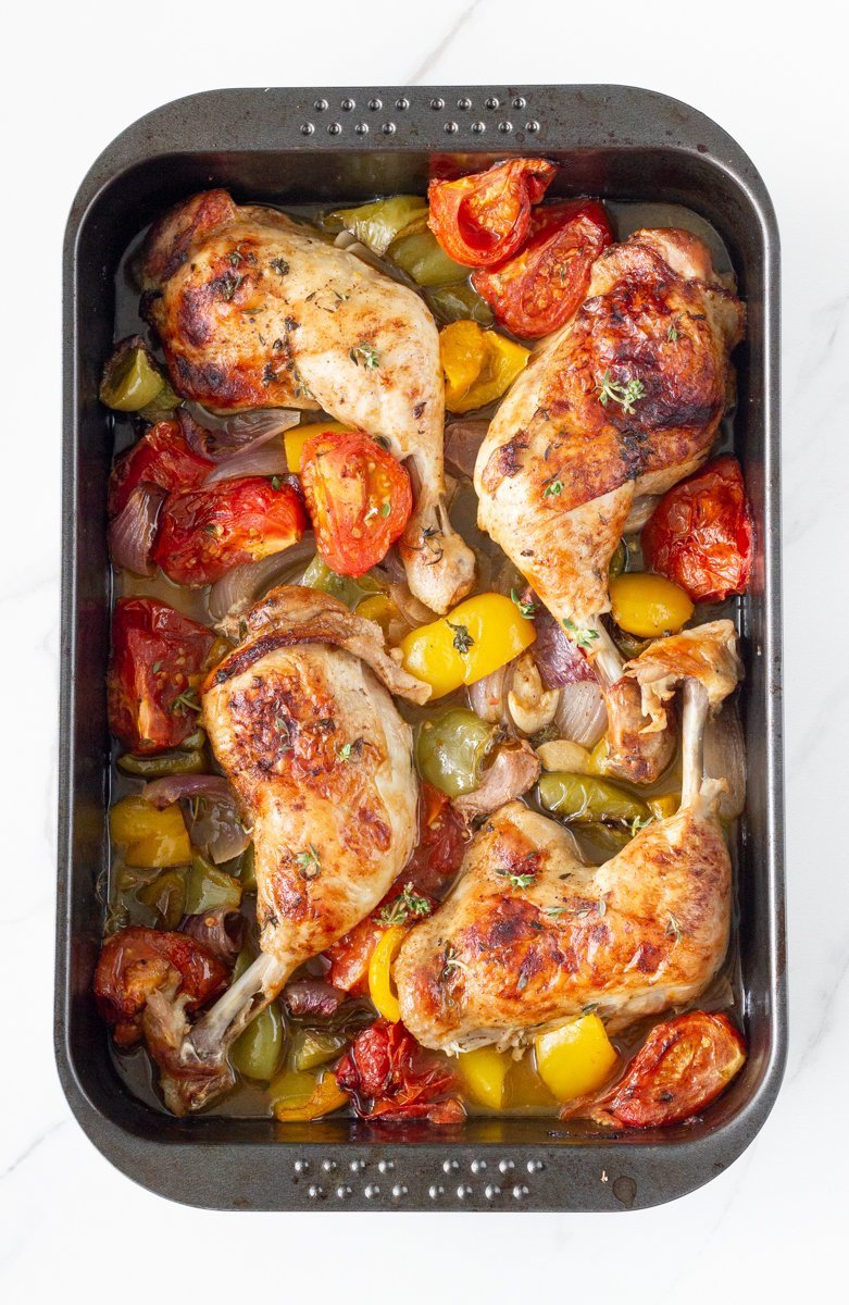 One tray oven baked chicken and vegetables is your weekly go-to roast chicken dish. This easy to make one pan dinner is made with a delicious marinade and easy to prep vegetables.