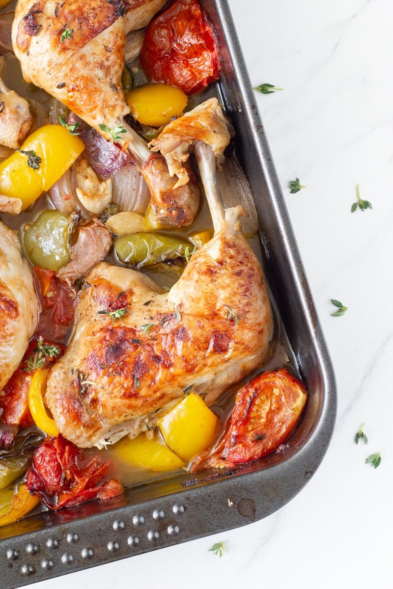 One tray oven baked chicken and vegetables is your weekly go-to roast chicken dish. This easy to make one pan dinner is made with a delicious marinade and easy to prep vegetables.