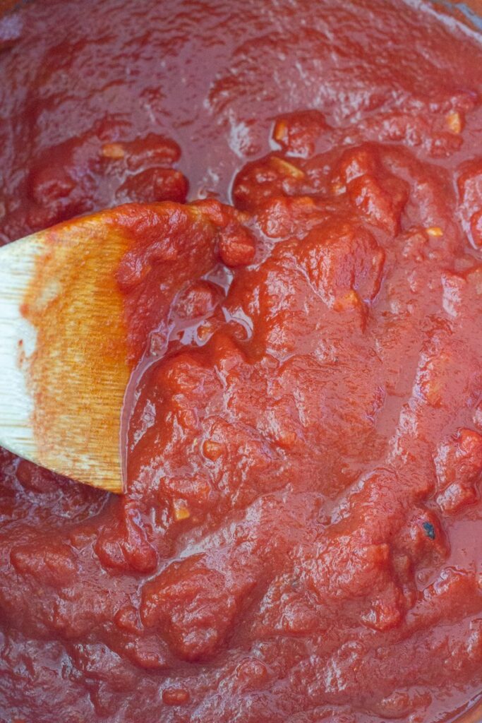 Basic Italian Tomato Sauce - this is my family recipe which has been passed down from generation to generation. It is made with 4 simple ingredients - diced tomatoes, tomato paste, garlic and olive oil.