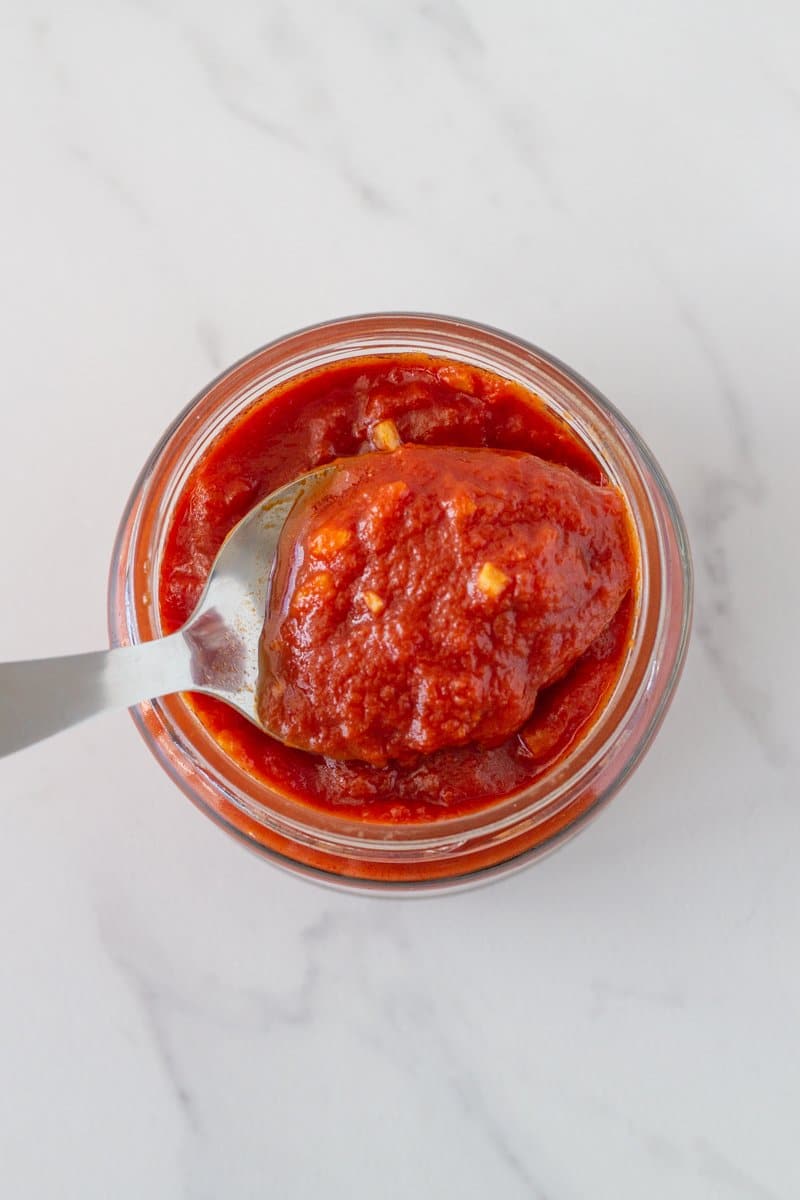 Basic Italian Tomato Sauce - this is my family recipe which has been passed down from generation to generation. It is made with 4 simple ingredients - diced tomatoes, tomato paste, garlic and olive oil.