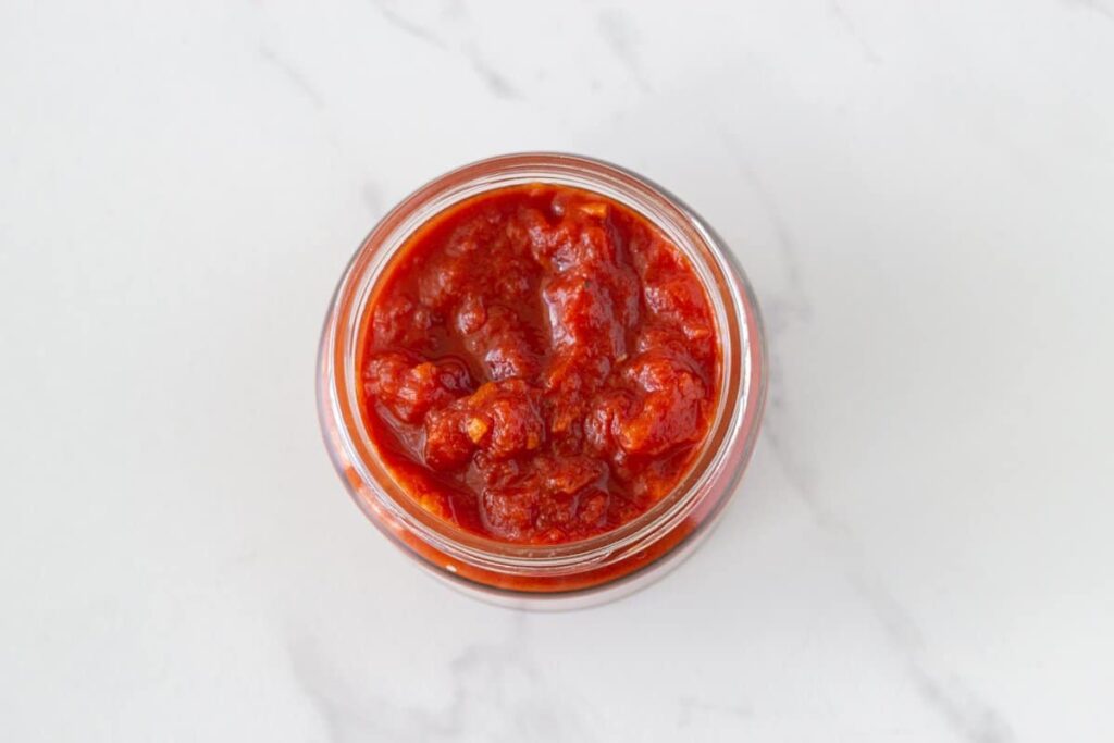 Basic Italian Tomato Sauce - this is my family recipe which has been passed down from generation to generation. It is made with 4 simple ingredients - diced tomatoes, tomato paste, garlic and olive oil.