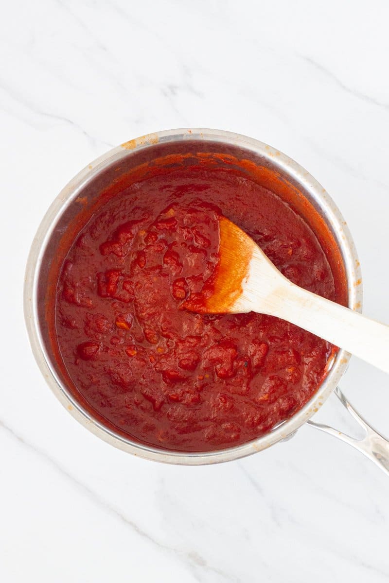 Basic Italian Tomato Sauce - this is my family recipe which has been passed down from generation to generation. It is made with 4 simple ingredients - diced tomatoes, tomato paste, garlic and olive oil.