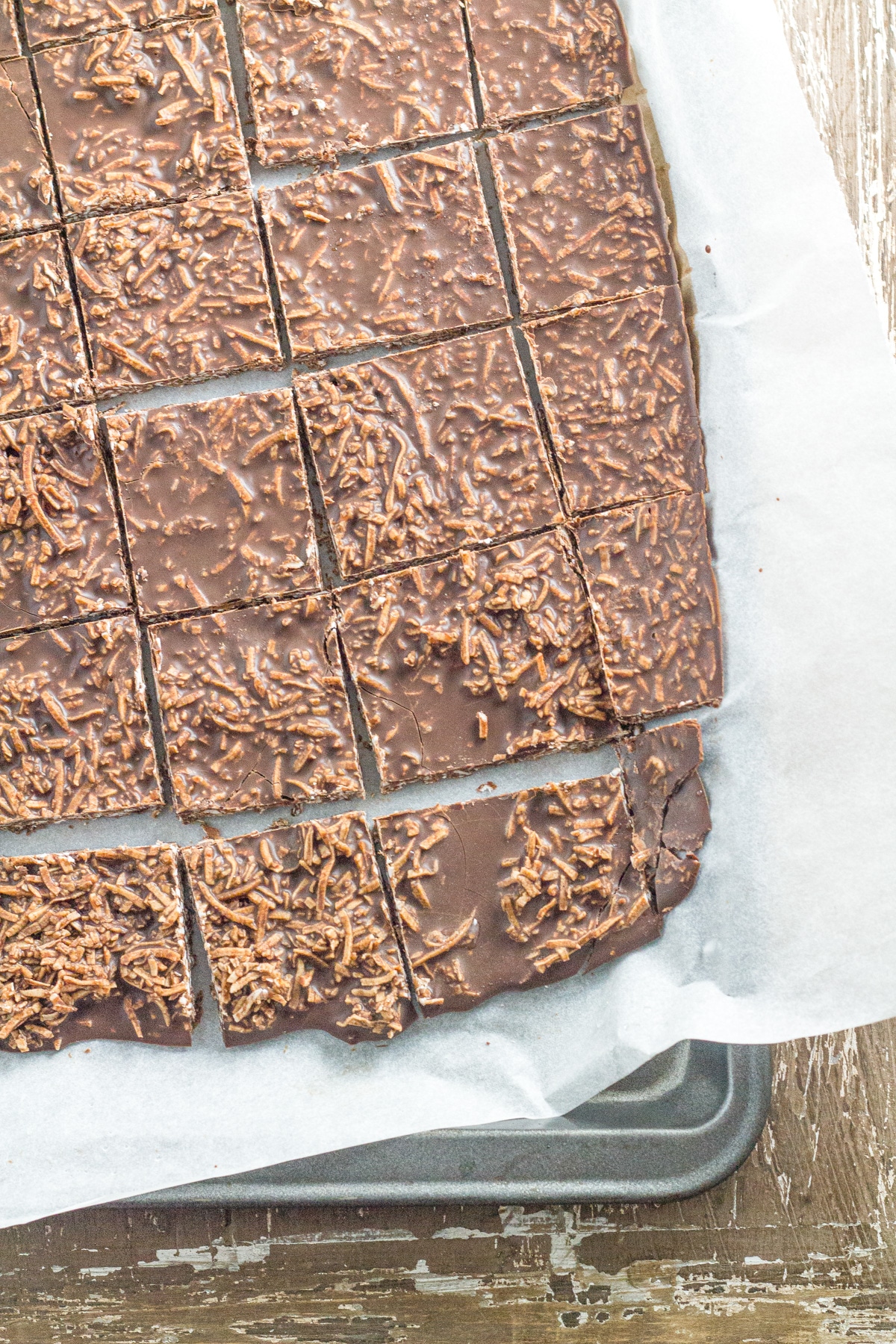 The chocolate sliced on a baking tray.