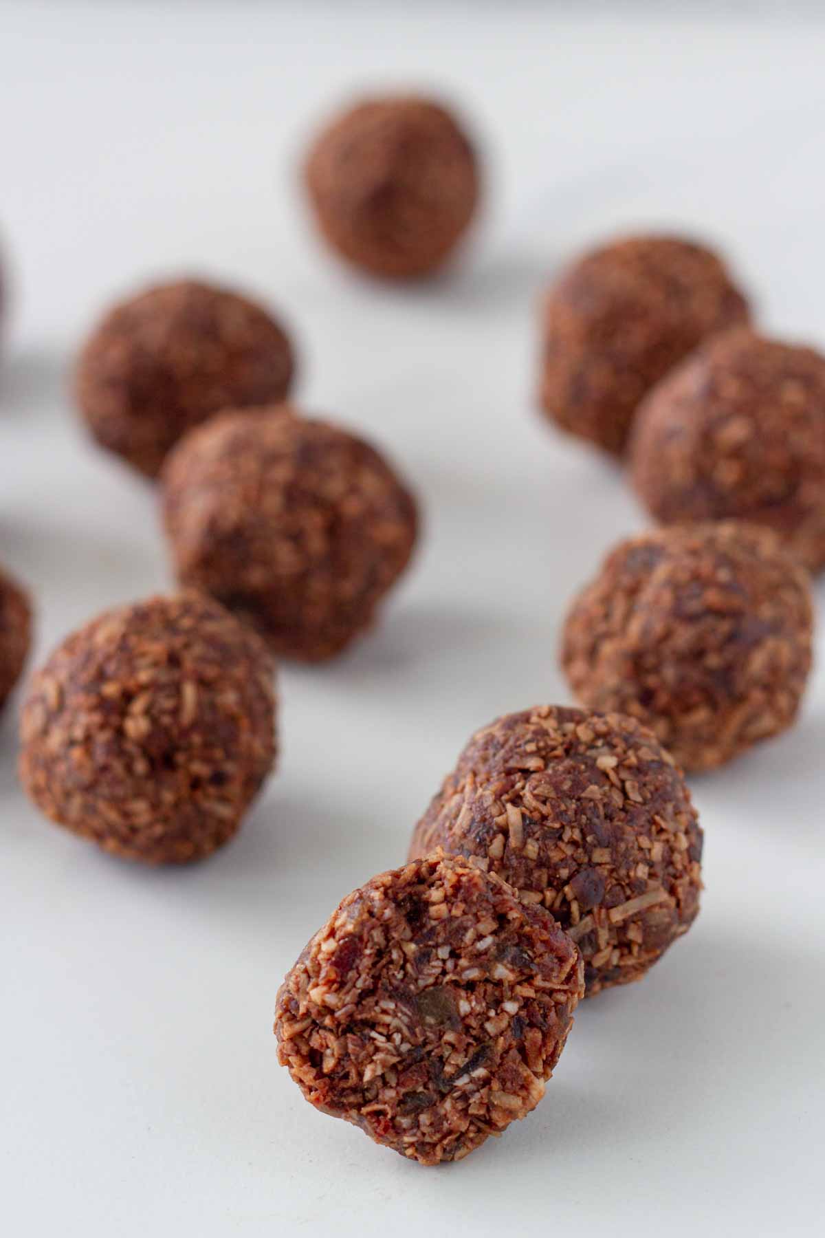 Bliss balls on a white surface.