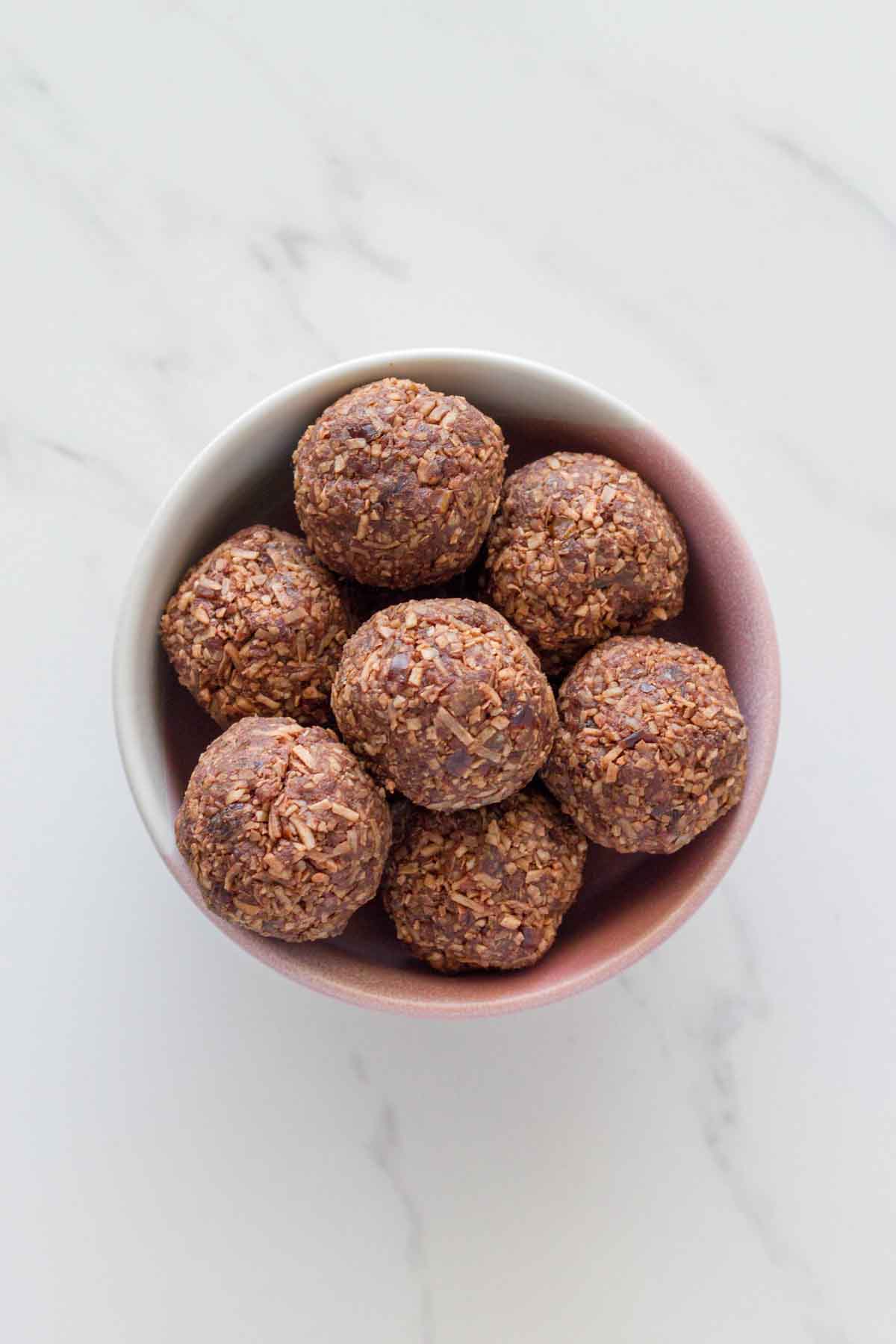 A bowl of coconut chocolate bliss balls.