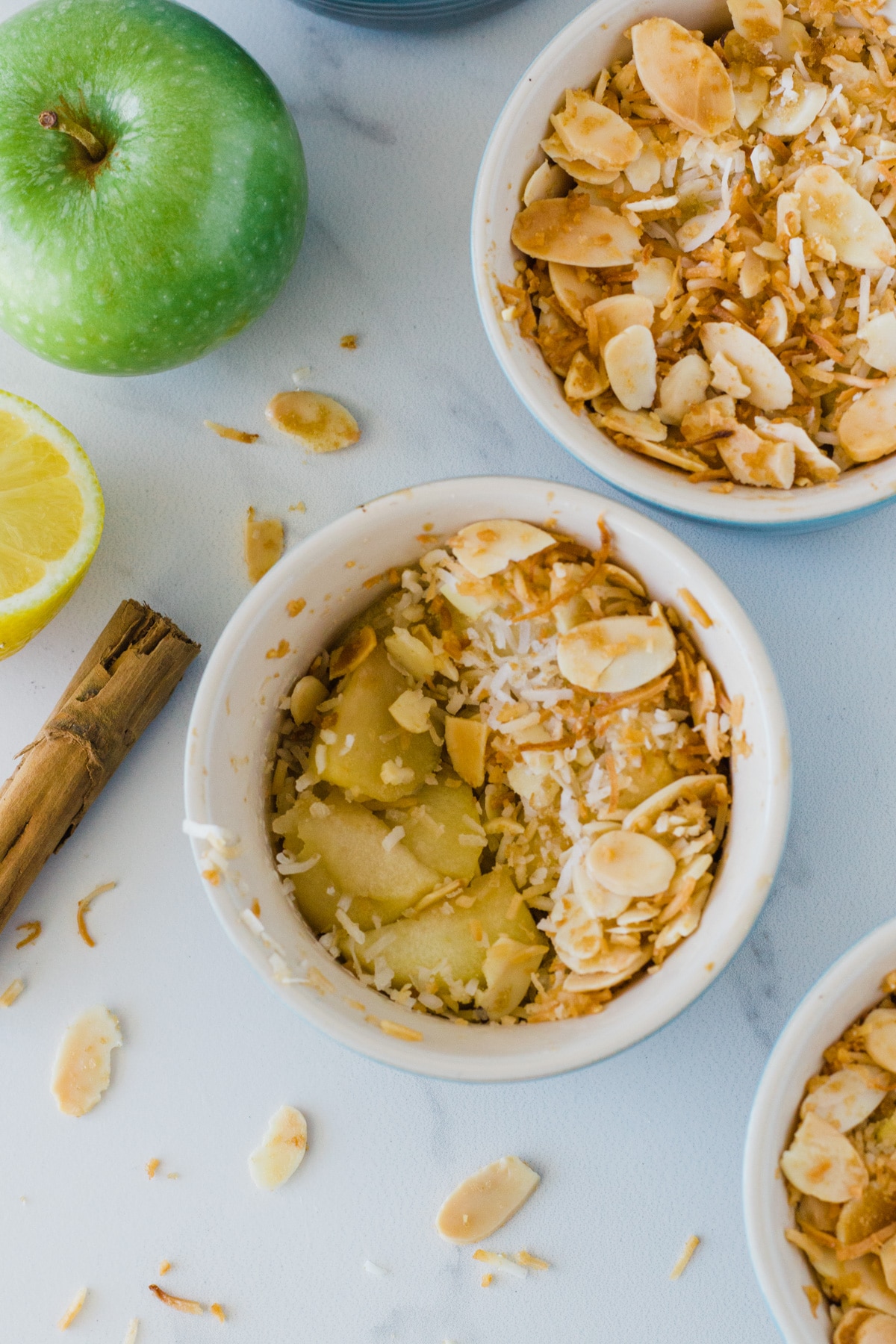 Three ramekins of cooked crumble.