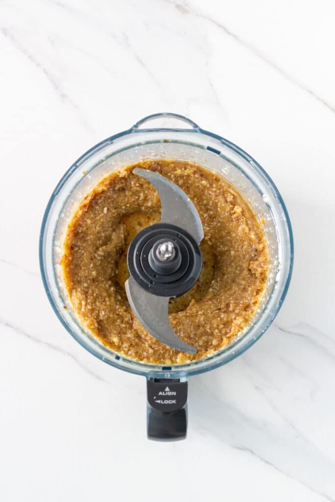 photo of food processor bowl with processed caramel layer ingredients