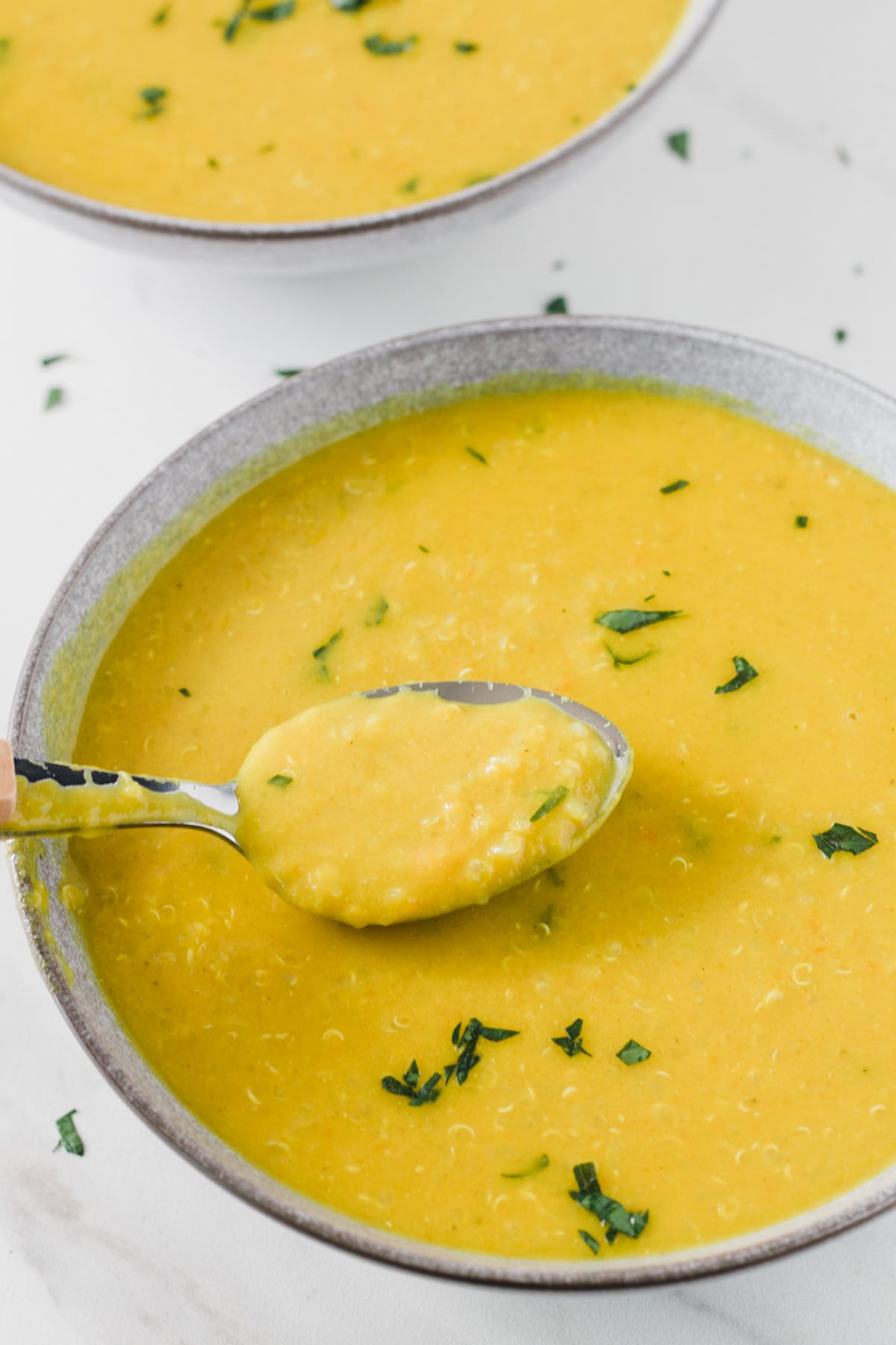 spoonful of the red lentil and quinoa soup.