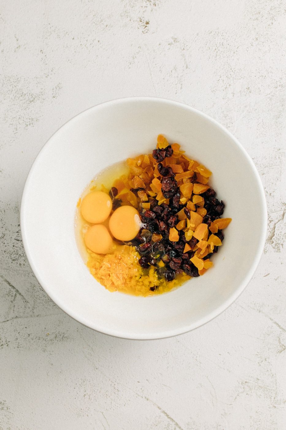 Image of fruit and wet ingredients in a mixing bowl