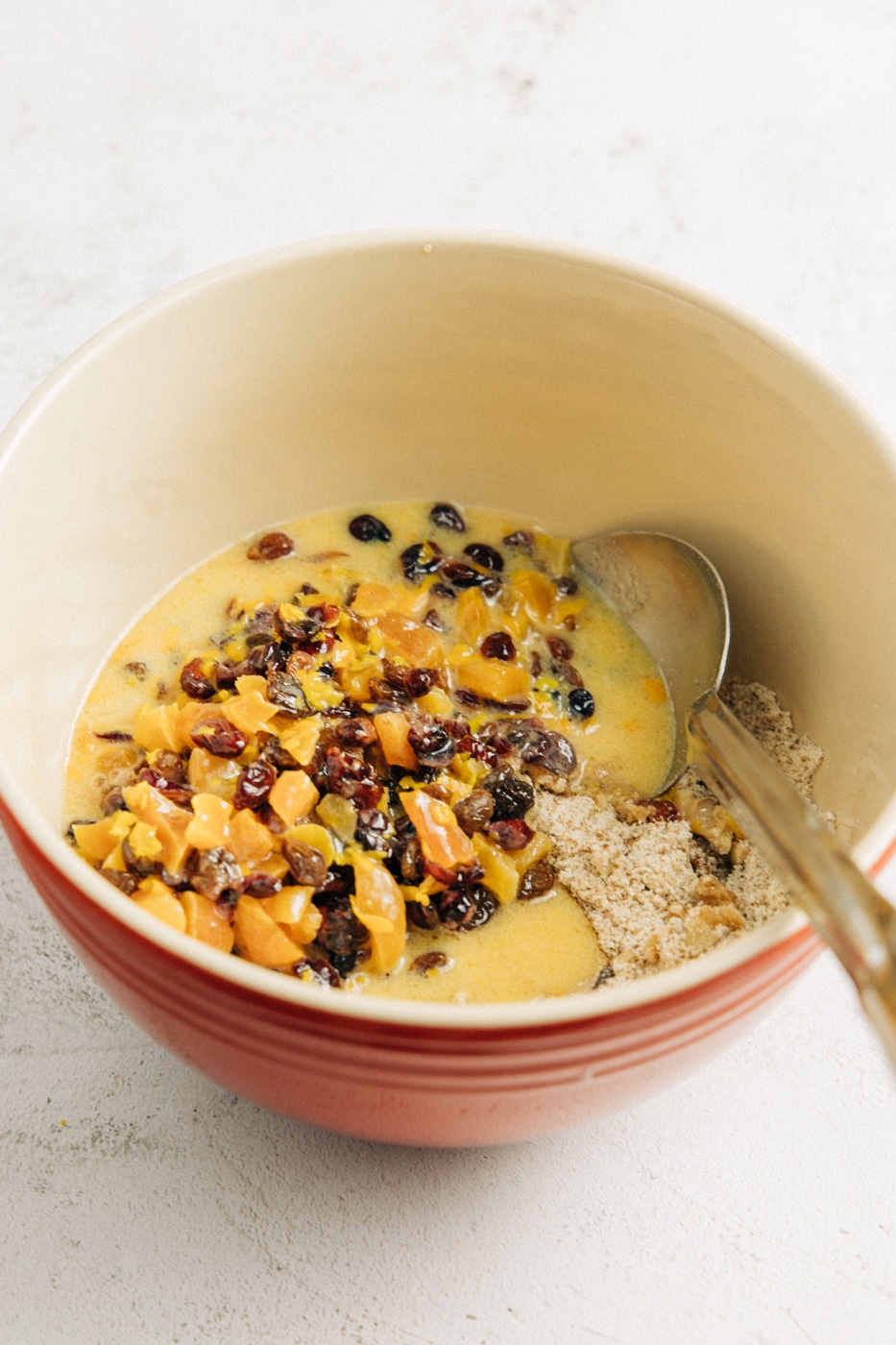 image of wet and dry ingredients added together in a mixing bowl