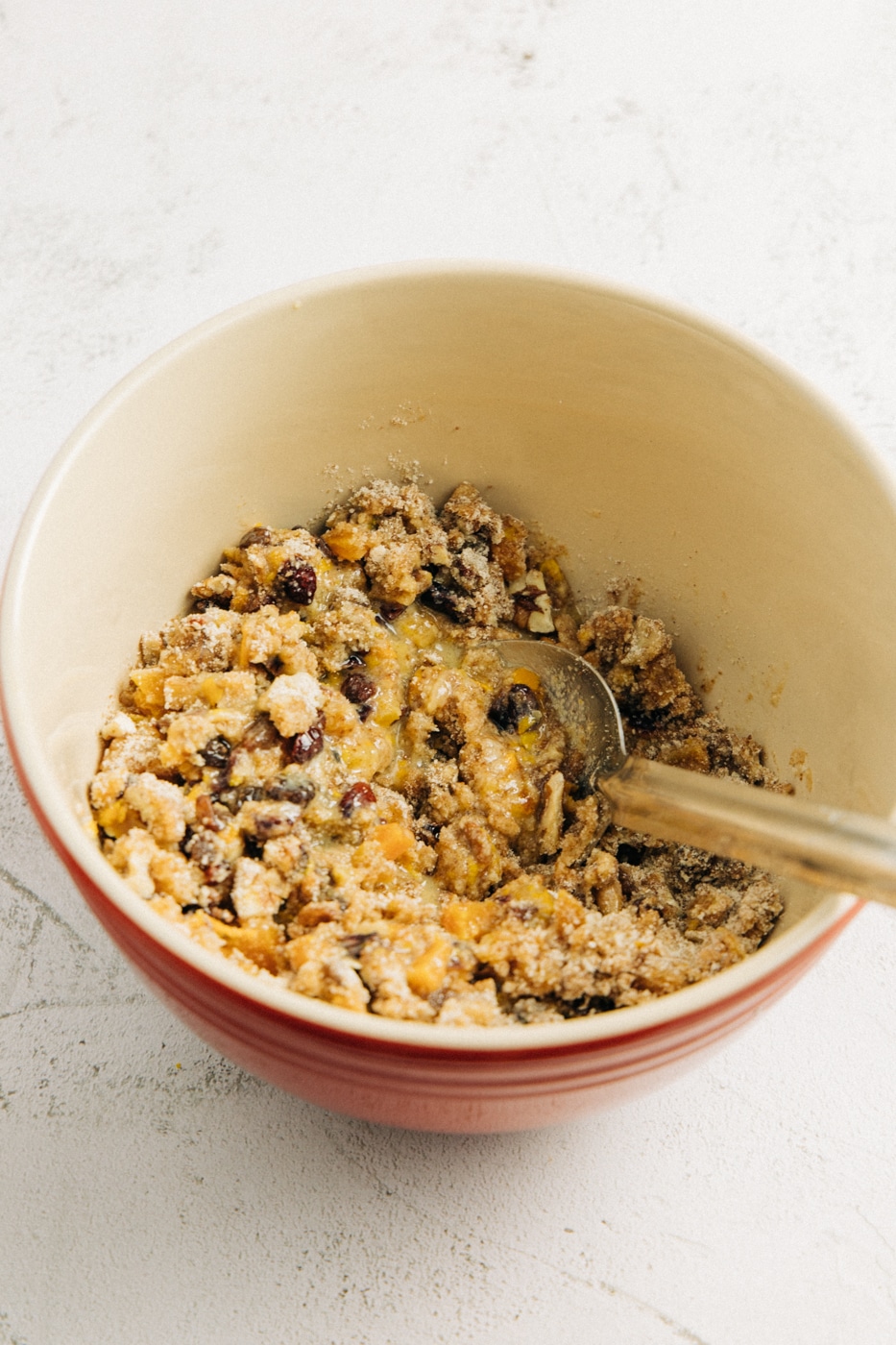 image of wet and dry ingredients mixed together in a mixing bowl