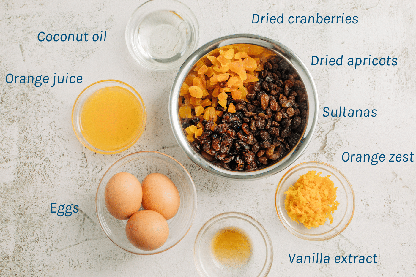 Remaining ingredients - coconut oil, orange juce, eggs, vanilla extract, orange zest, sultanas, dried apricots, dried cranberries.