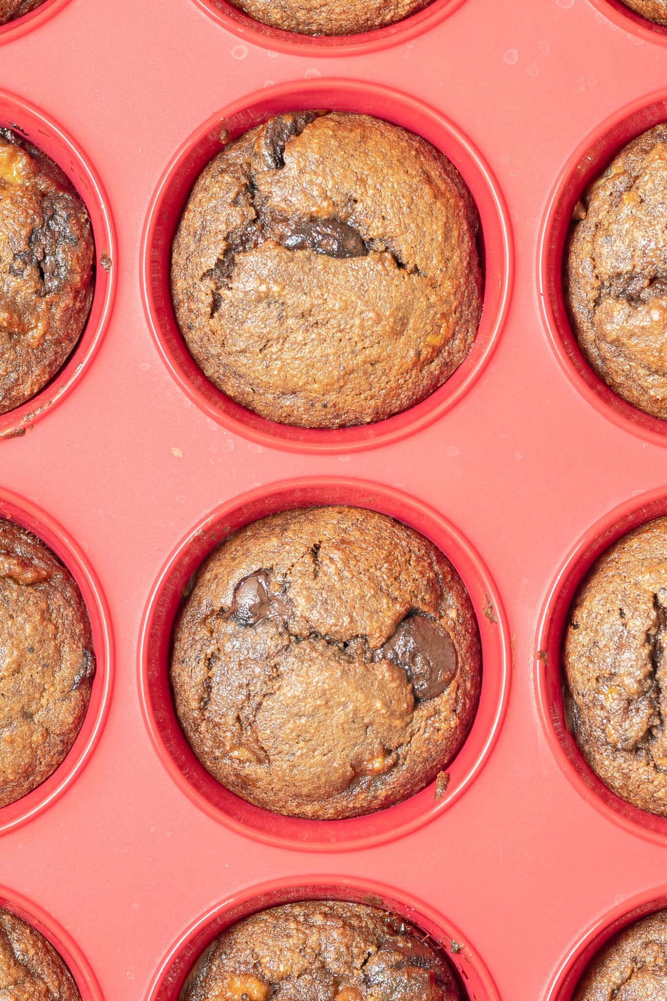 Cooked muffins in a silicone muffin tray.