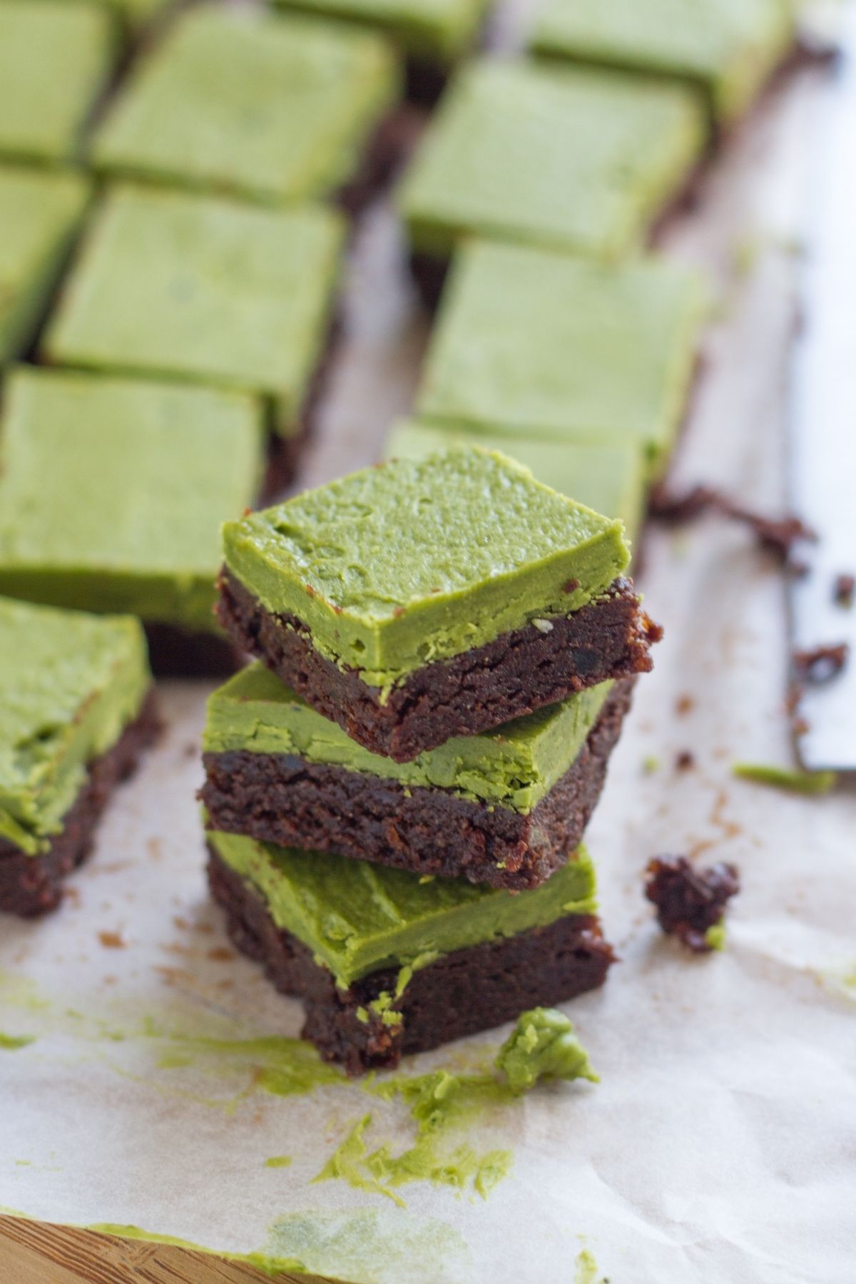 Matcha chocolate bars stacked on top of each other.