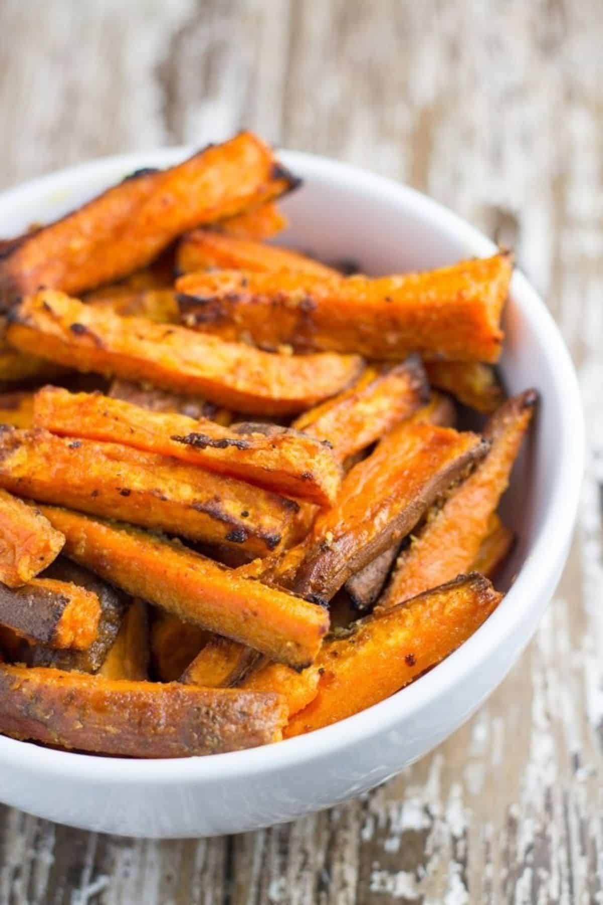 Bowl of baked sweet potato wedges.