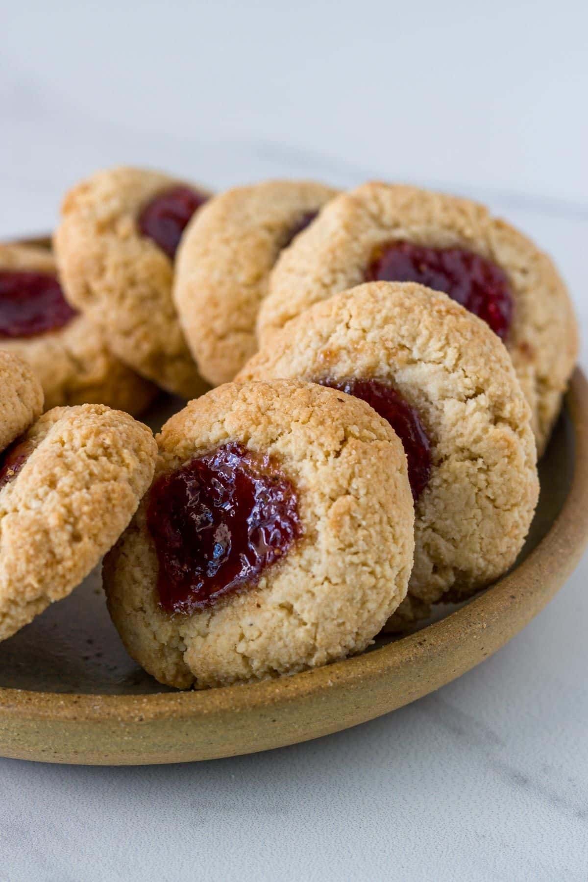 A plate of gluten free thumbprint cookies. 