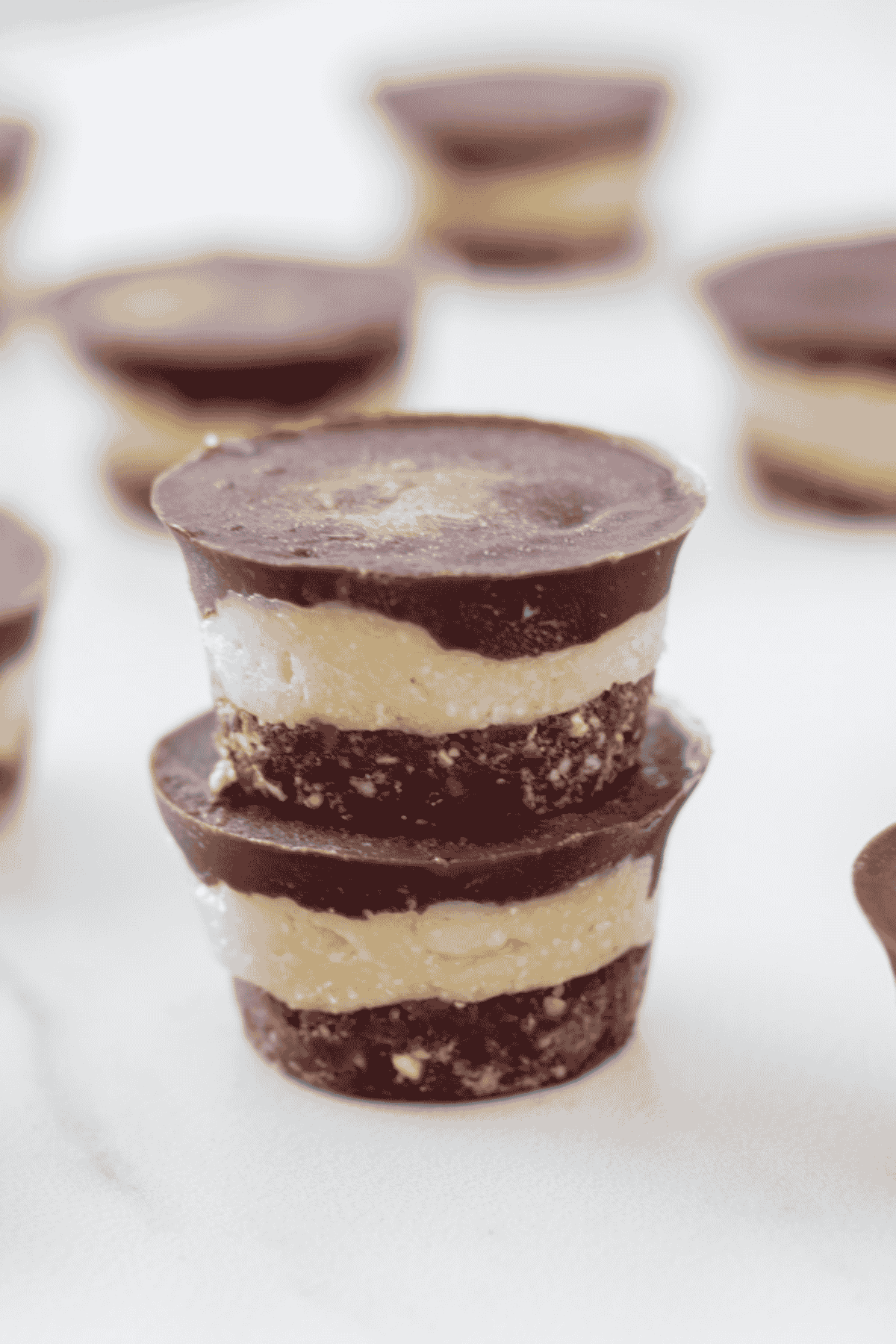 Stack of no-bake mint slice bites.